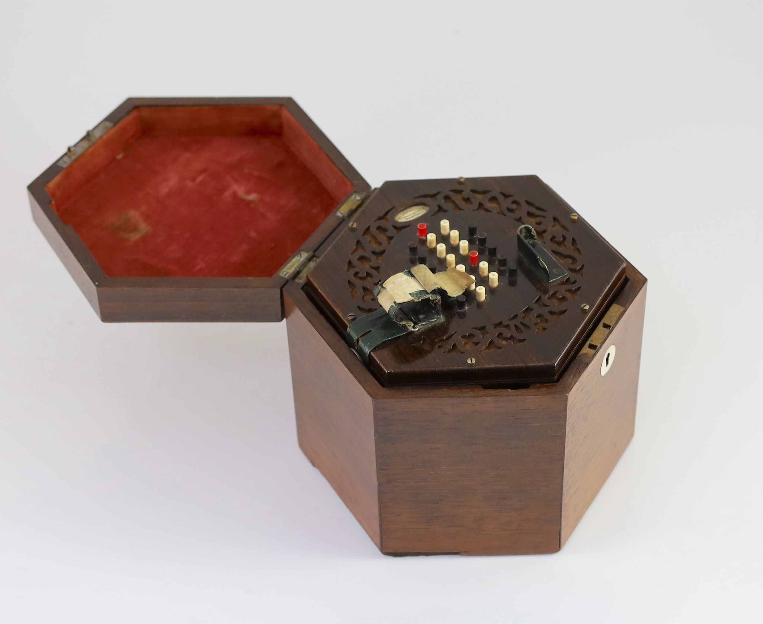 A 48-key C. Wheatstone English model rosewood concertina, diameter 18cm, housed in the original rosewood case